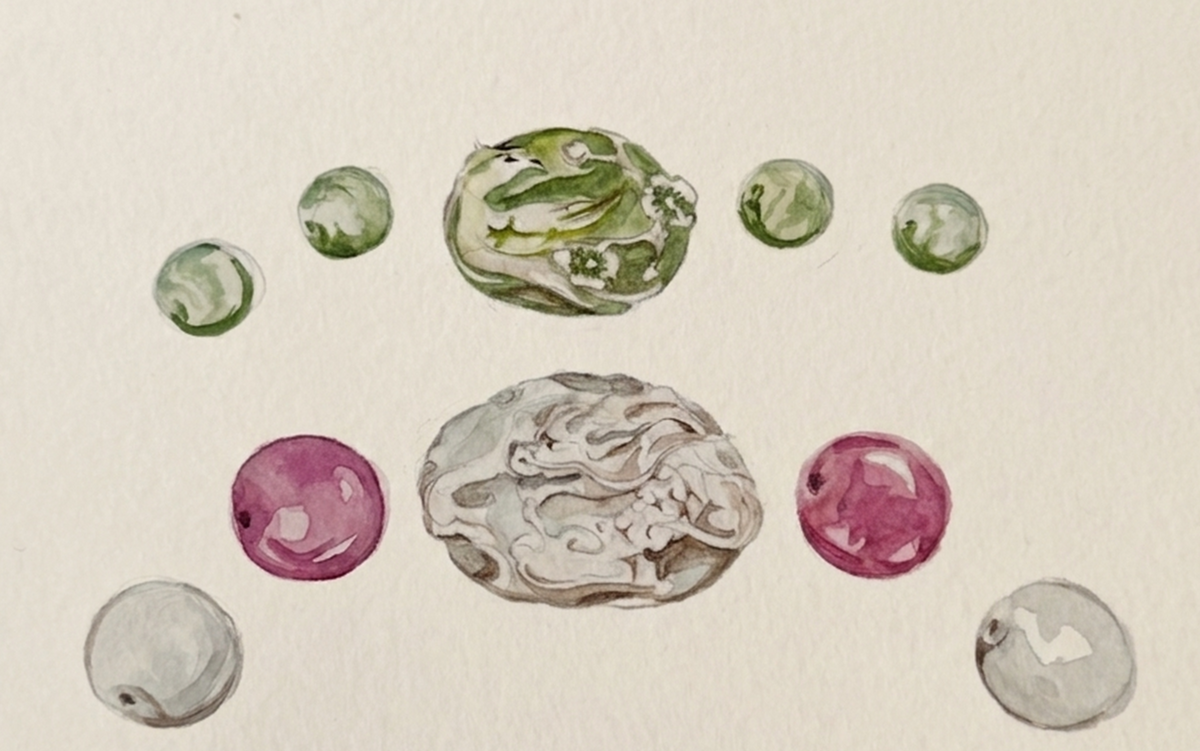 Color sketches of bracelet designs with carved centerpieces.